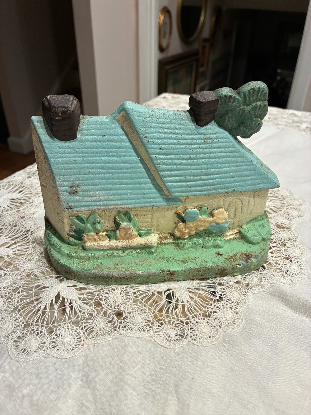 vintage hand-painted cast iron cottage or Irish countryside house doorstop.